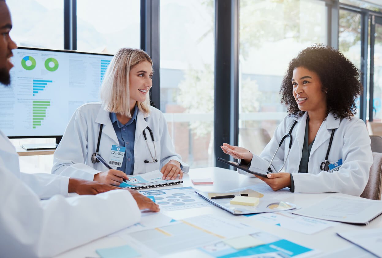 Medical billing specialists working together in a modern healthcare office