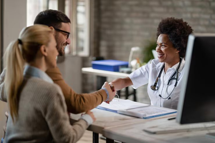 Healthcare administrator shaking hands with a Prime Medex billing consultant