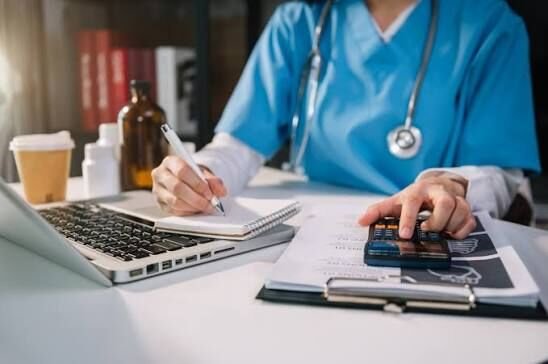 Billing staff entering medical charges into practice management software