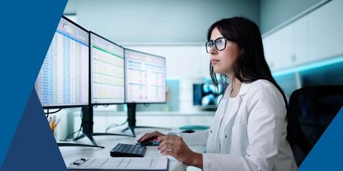 Medical billing specialist processing claims on a computer