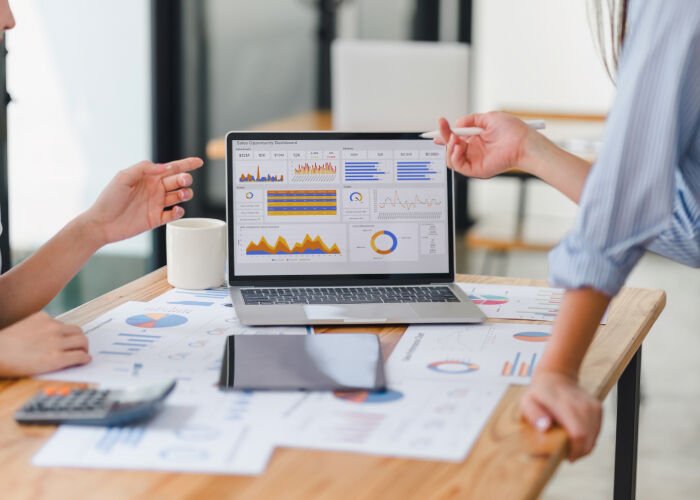 Revenue cycle management analytics dashboard on a laptop screen